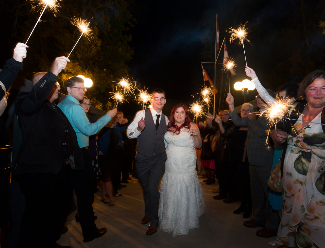 Bride and Groom and guests sparklers