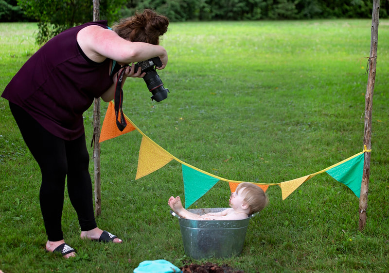 Jenn Schofield photographer and baby in bath outside cake smash