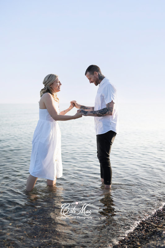 Beach engagement photography shoot in water