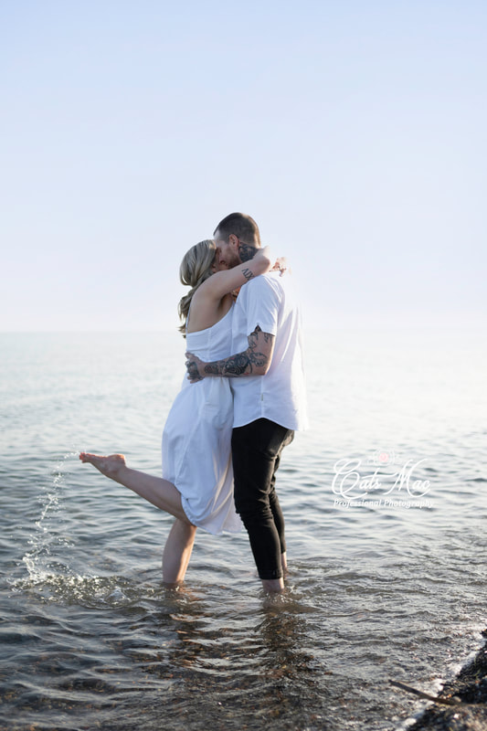 Beach engagement photo session in water