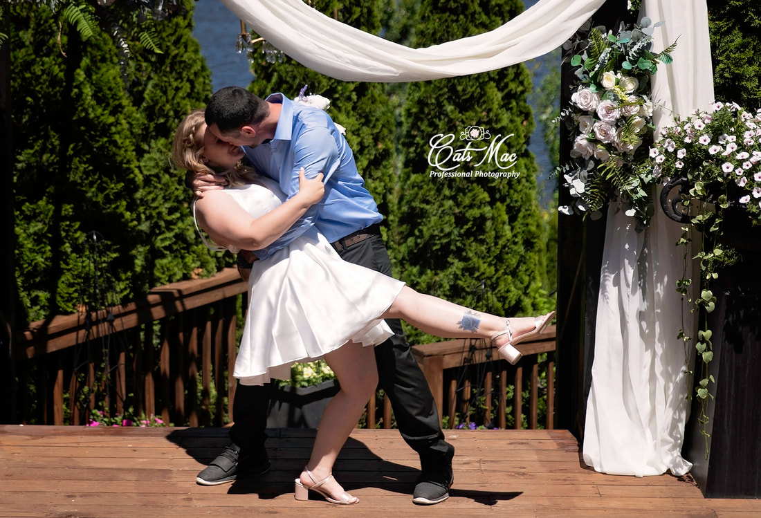 Stillwater on the Lake arbour groom dipping bride