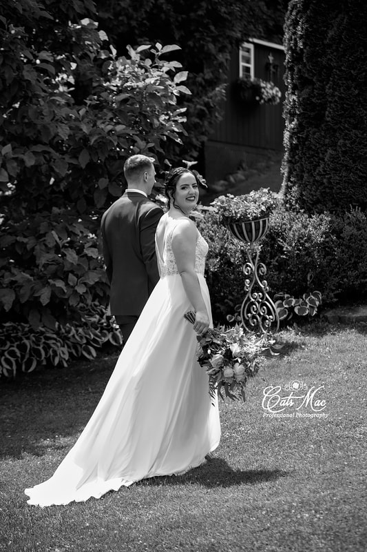 black and white image bride and groom Stillwater on the Lake gardens