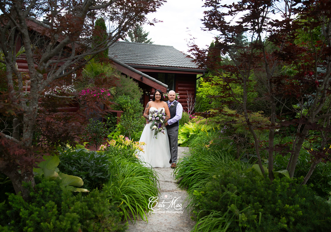 Bride and groom in the gardens at Stillwater on the Lake