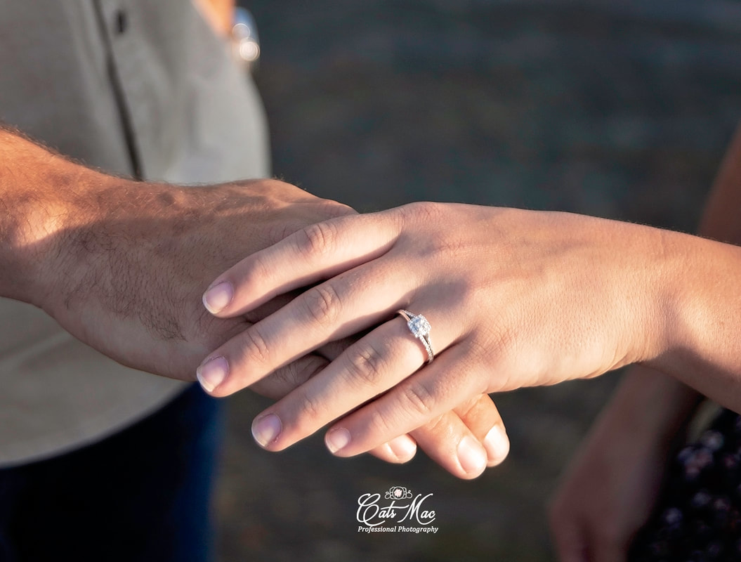 Engagement ring on finger Session Photo