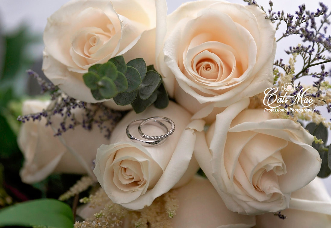 Wedding rings on rose bouquet at Stillwater on the Lake Peterborough