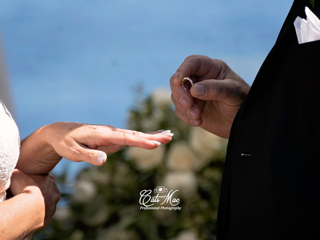 Getting married exchanging wedding rings Stillwater on the Lake elopement