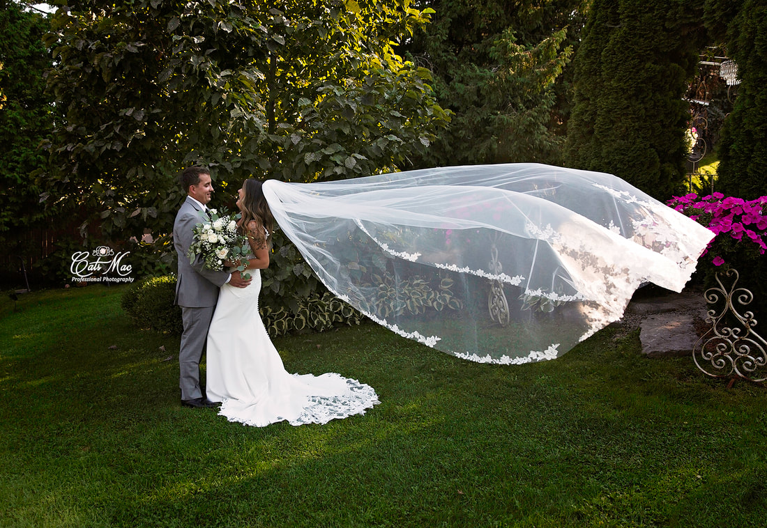 Stillwater on the Lake bride and groom elopement gardens floating veil
