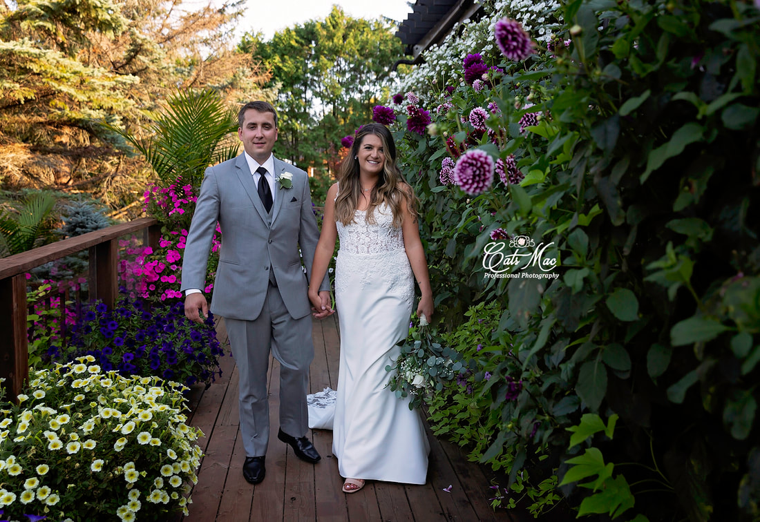 Stillwater on the lake bride and groom elopement Dahlia pathway