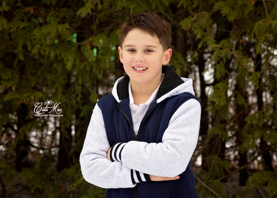 photo session boy standing in snow family photos 