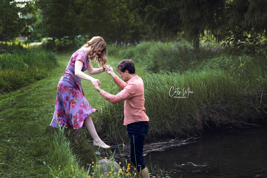 Engagement photo session couple stepping into water