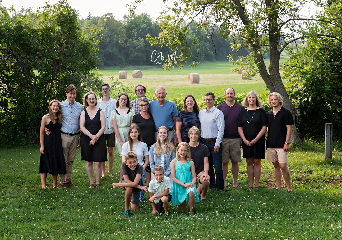 Photo of large multi generational family in field