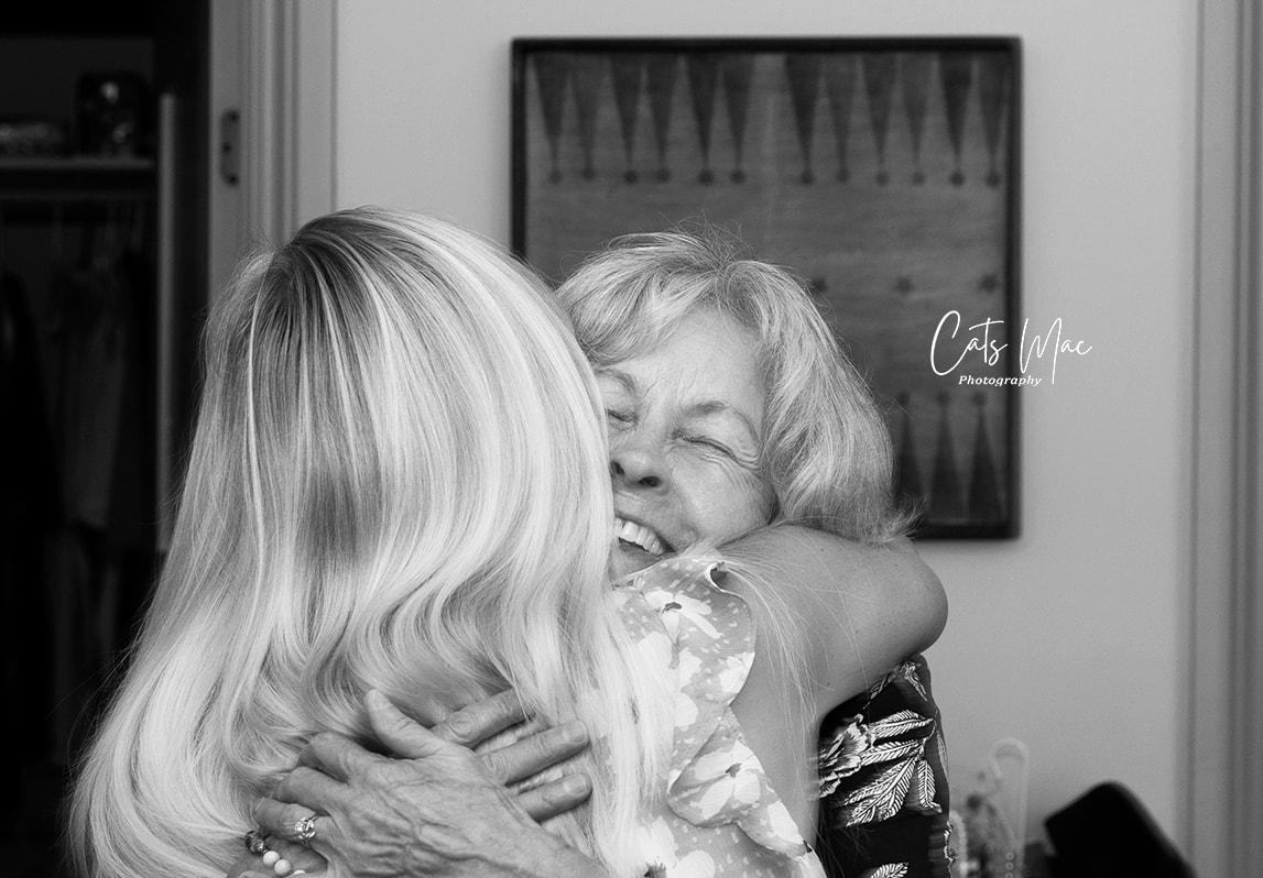 Daughter giving her mother a hug 50th wedding anniversary photos 
