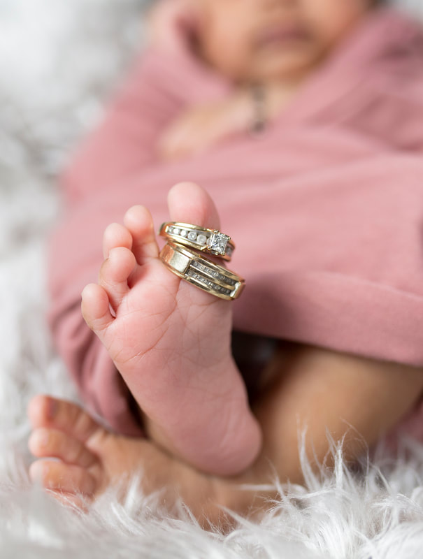 Newborn photo session wedding rings