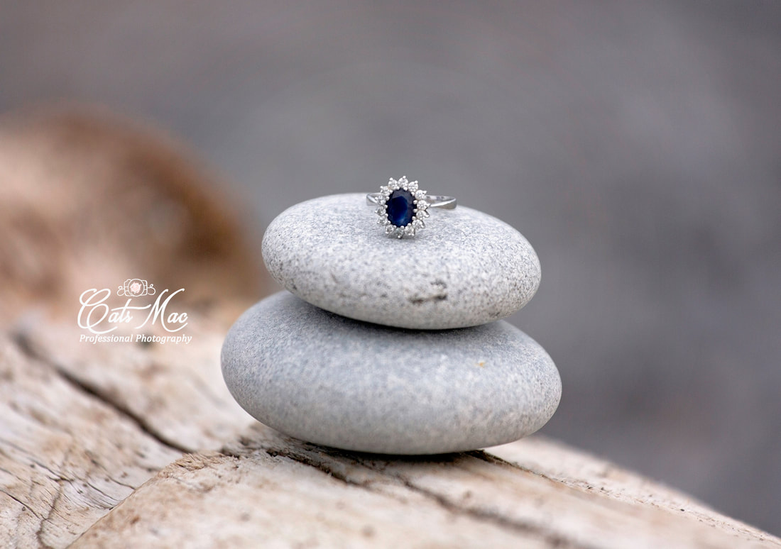Engagement ring beach rock sand water
