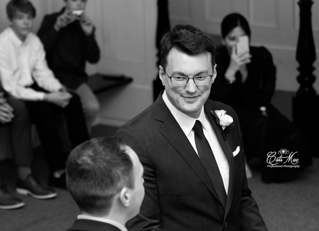 black and white photo of groom at Victoria Town Hall Cobourg 