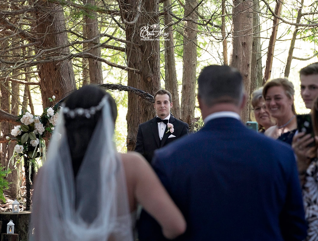 Groom watching bride come down aisle Northumberland Forest wedding ceremony