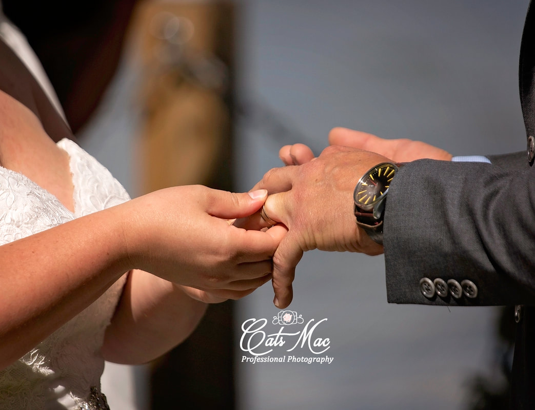 Exchanging wedding rings bride and groom